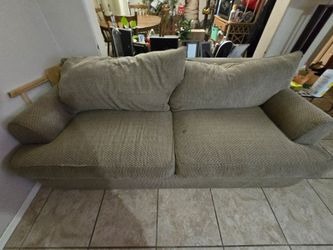 Tan pull out sofa