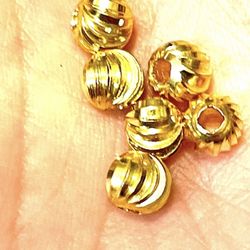 Gold Tone Swirl Beads