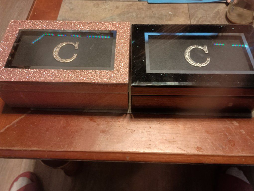 Two Jewelry Boxes With The Letter C On It