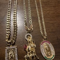 1 Cuban Chain In Gold Plated With Square Virgin And 2 Mariner Chain With Pendants