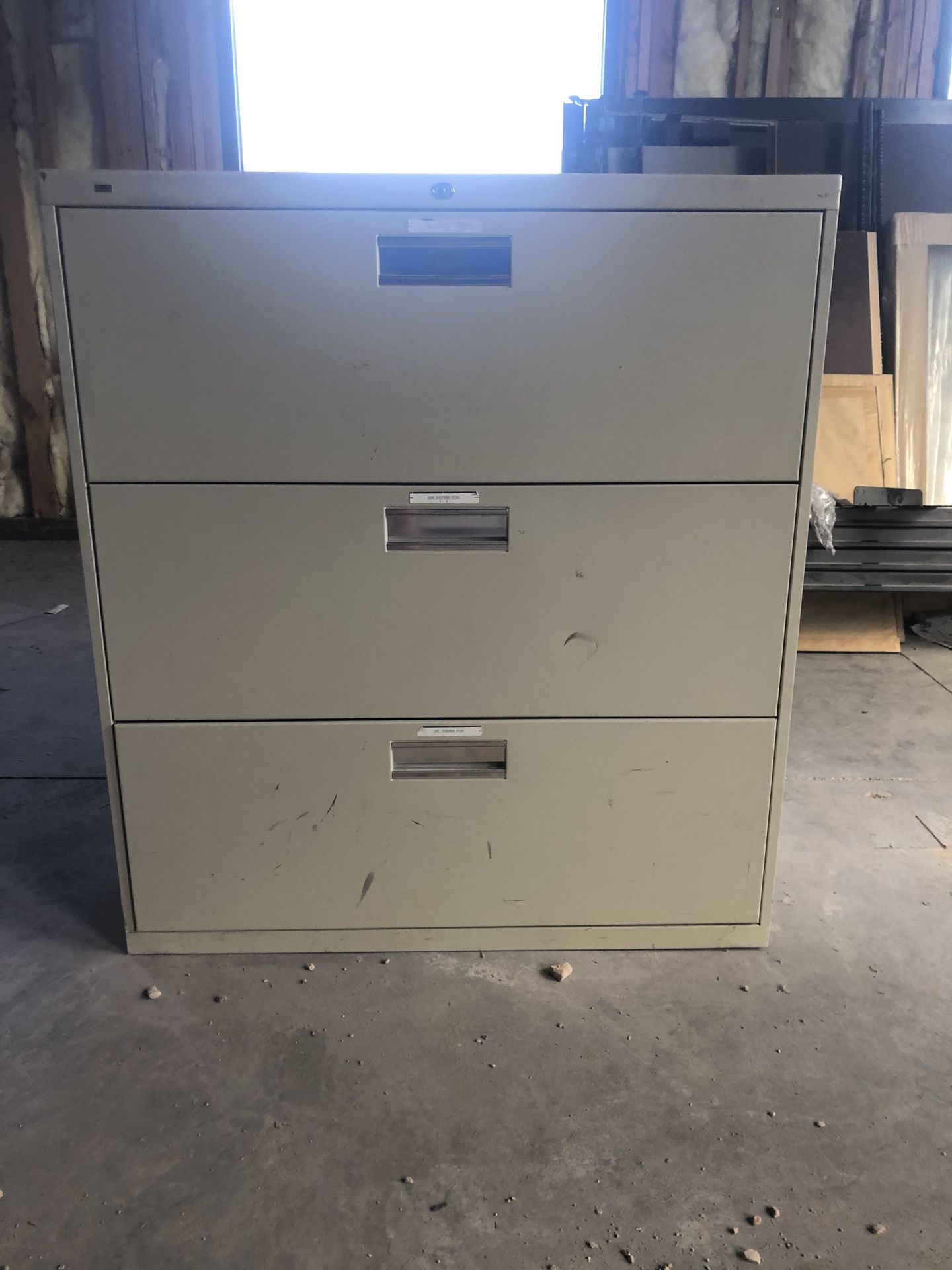 Cream colored file cabinet