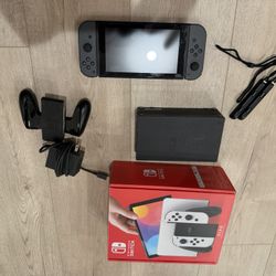 Black Nintendo Switch And Mario kart