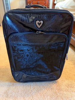 SUITCASE  16"w x 7"deep x 21"tall; cross streets are Arapaho & Waterview