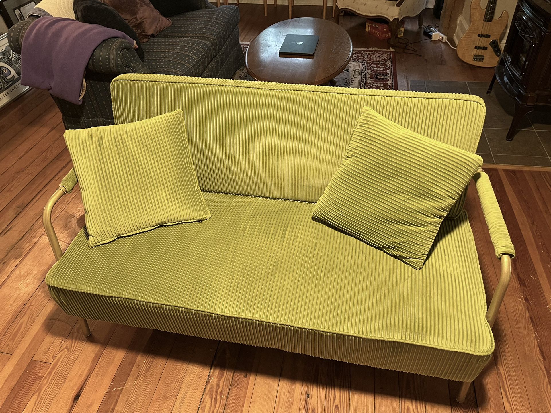 green loveseat couch