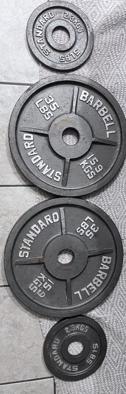 (2) 35lb Plates / (2) 5lb Plates / Adjustable Squat Stand / 2” Olympic Barbell / Set Of 2” Barbell Clips