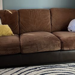 Leather and suede sofa with cushion covers