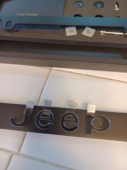Jeep black license plate frame one piece. Black frame with Raised lettering. NEW
