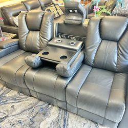 Like New Leather Electric Dual Reclining Couch With Electric Headrests And Dual USB And Led Lightning 