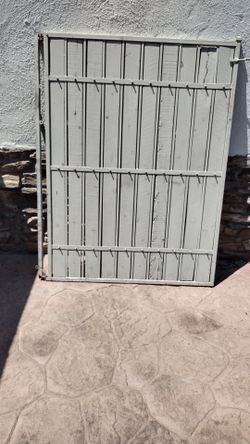 White metal door gate. .wood panel .size. .4'feet wide X. 5'feet tall.      $. 190.