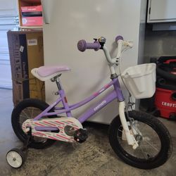 Girls bike - 14" Tires with training wheels. $15