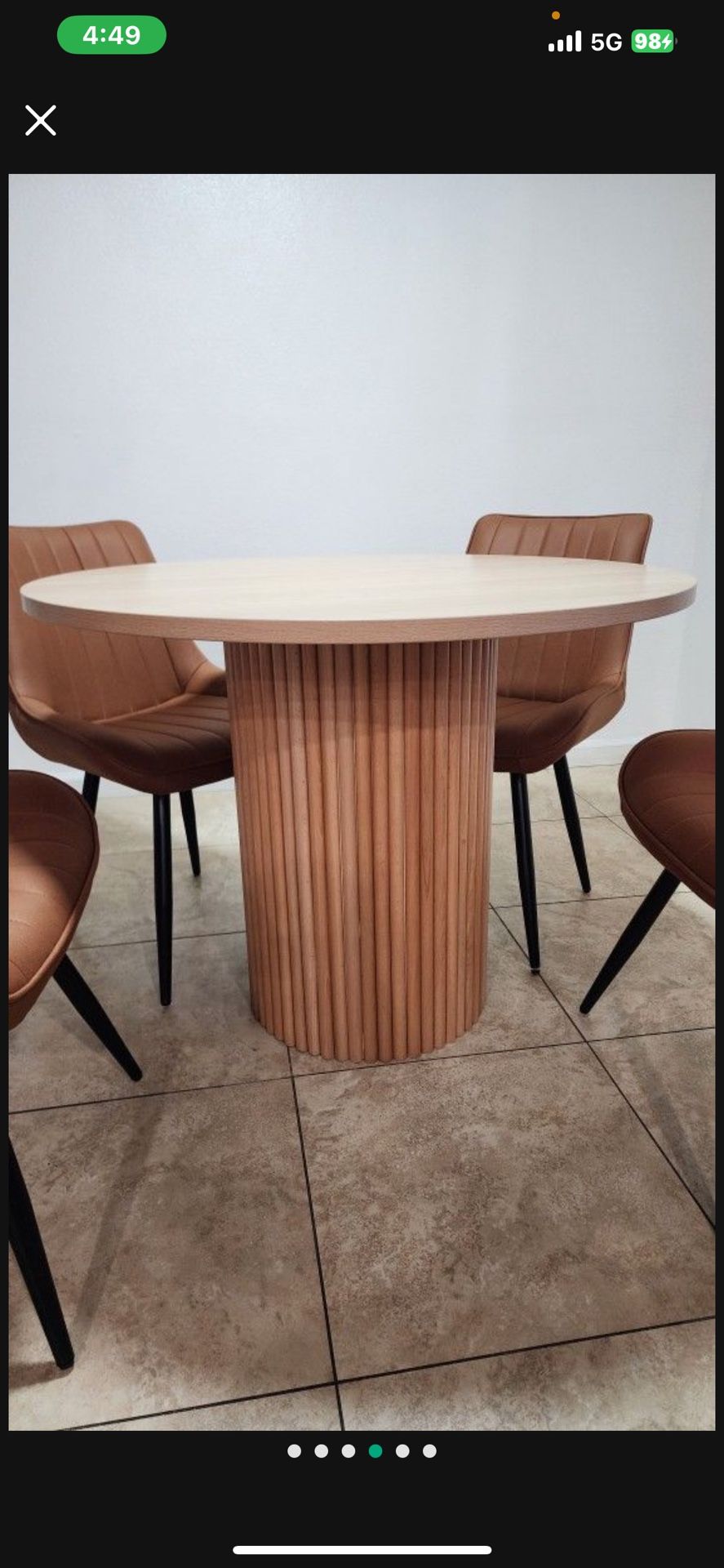 Round table featuring a modern and minimalist design.
