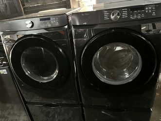 Samsung 27” wide (4.5cu.ft.) Front load washer and 27” wide (7.5 cu.ft.) Electric dryer laundry pair, Including  Pedestals.