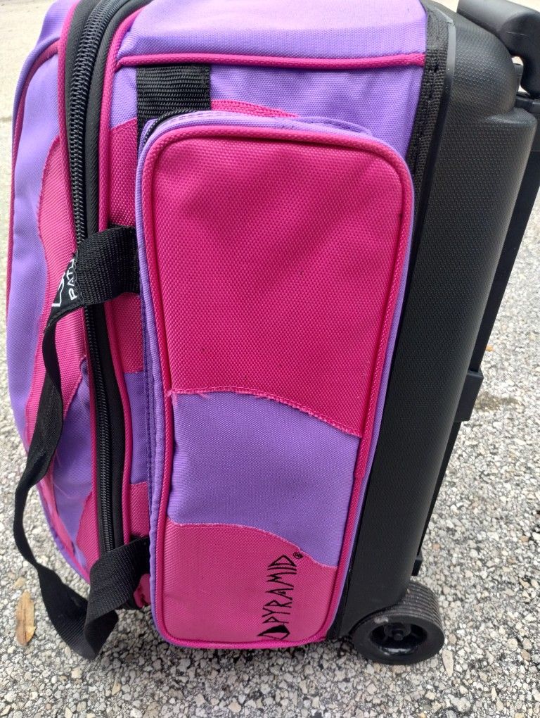 Two Bowling Balls And Rolling Bag