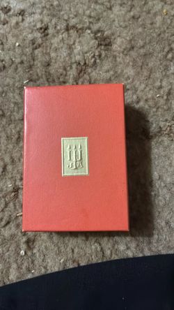 Small Red Hardcover Book with Gold Emblem