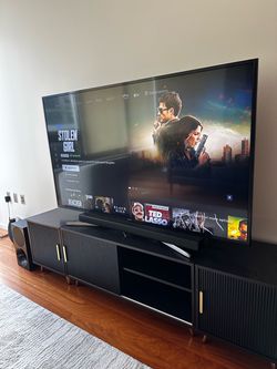 65” Samsung HDTV with sound bar and tv stand