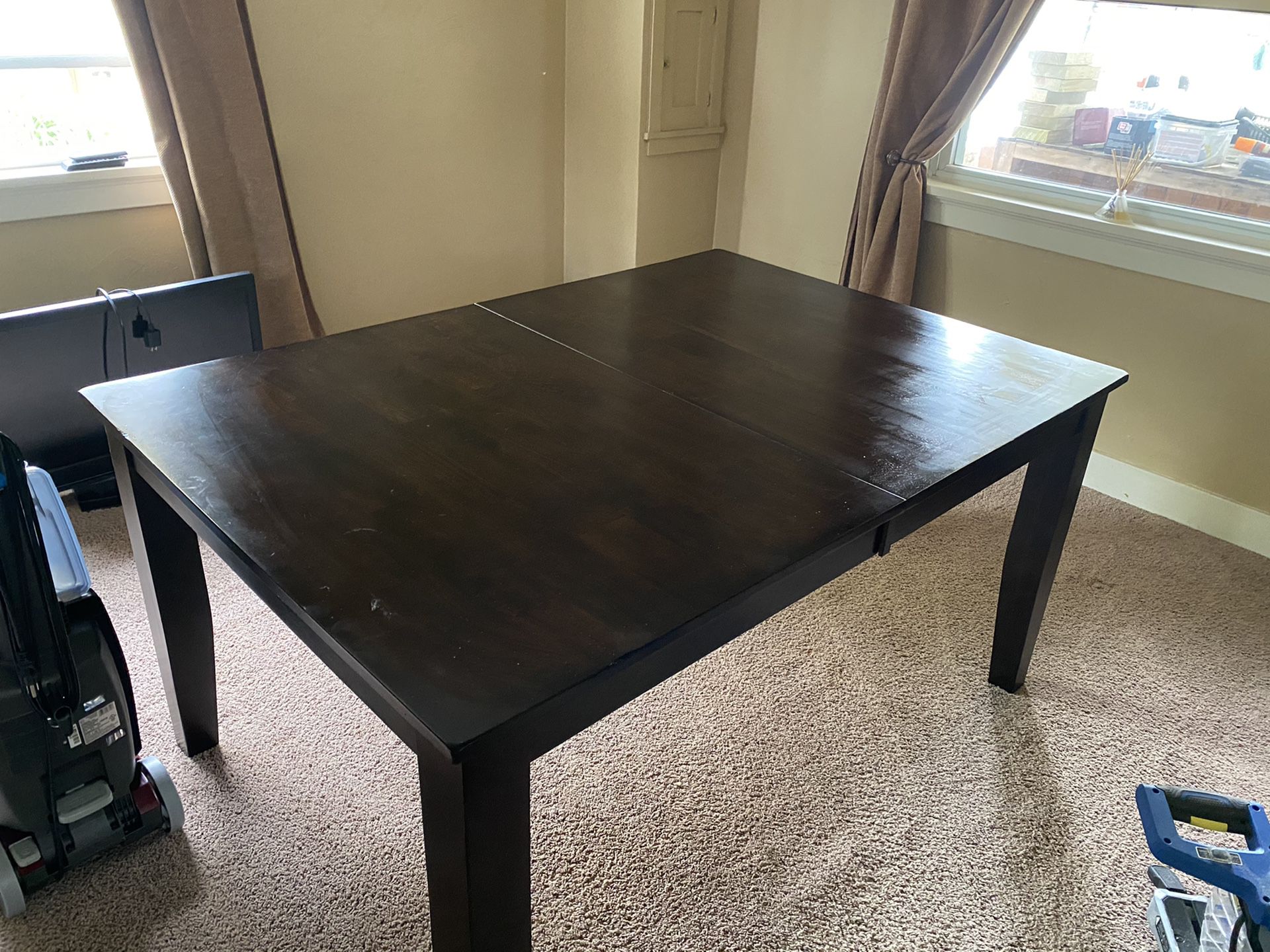 Levin brand brown wooden dining room table