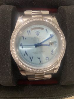 R luxury watch with Arabic numerals