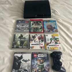 PS3 console with games and controller