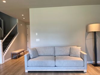 Crate and barrel sofa couch with oak wood bottom