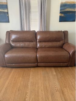 Brown leather reclining sofa