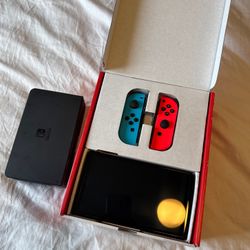 Nintendo Switch OLED (Neon Red/Blue) Like-new condition.  No scratches, scuffs, or cracks  Comes with 4 digital games  (will give you username / passw