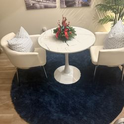 two Leather Seats Table And Rug 