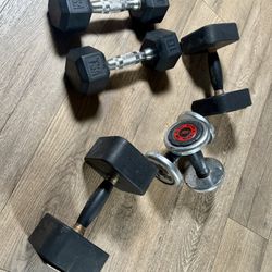 2 Pairs Of Dumbbells  5s And 10s Plus 2 Singles [Reebok) 15 And 20 lbs Respectively.