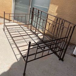 Dark brown twin bed with trundle. $30. Higley and ray.