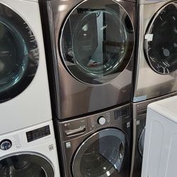 used like New 2021 LG Front Load Washer and NEW LG Stackable Gas Dryer Set in Black Stainless Steel