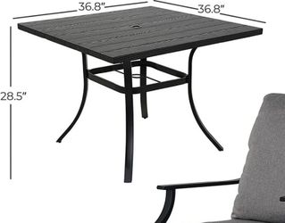 The table has a hole in the middle for inserting a patio umbrella.