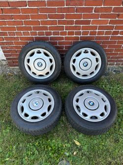 Bmw 15” Steelies wheels 5x120 rims with hub caps tires