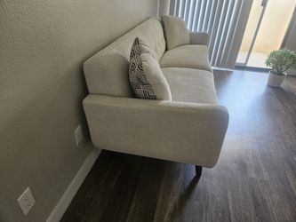 Mid century modern cream tufted sofa