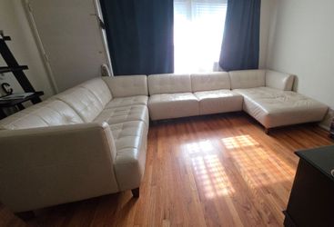 Beige faux leather sofa w/ chaise lounge