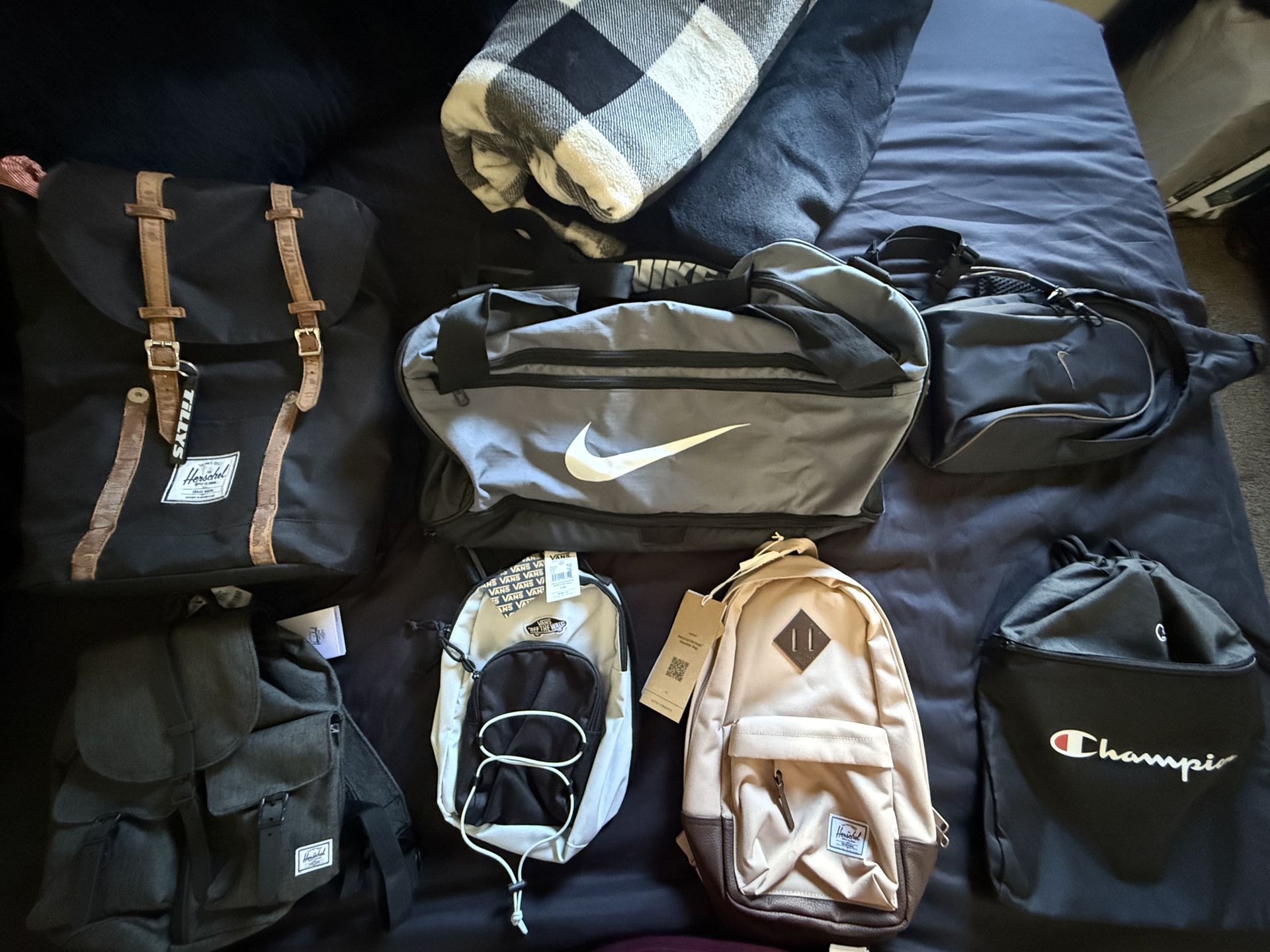 Duffel bag sling backpacks