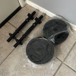 2 Bar Bells And 20lbs of Weights 