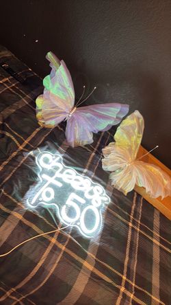 Cheers to 50 sign and butterflies