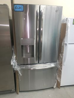 New GE 33in. French doors refrigerator with 1 year manufacturer warranty