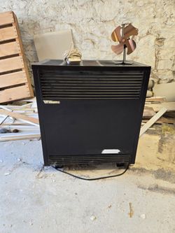 Free standing natural gas space heater.