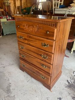 It’s five drawer pine finish tall chest