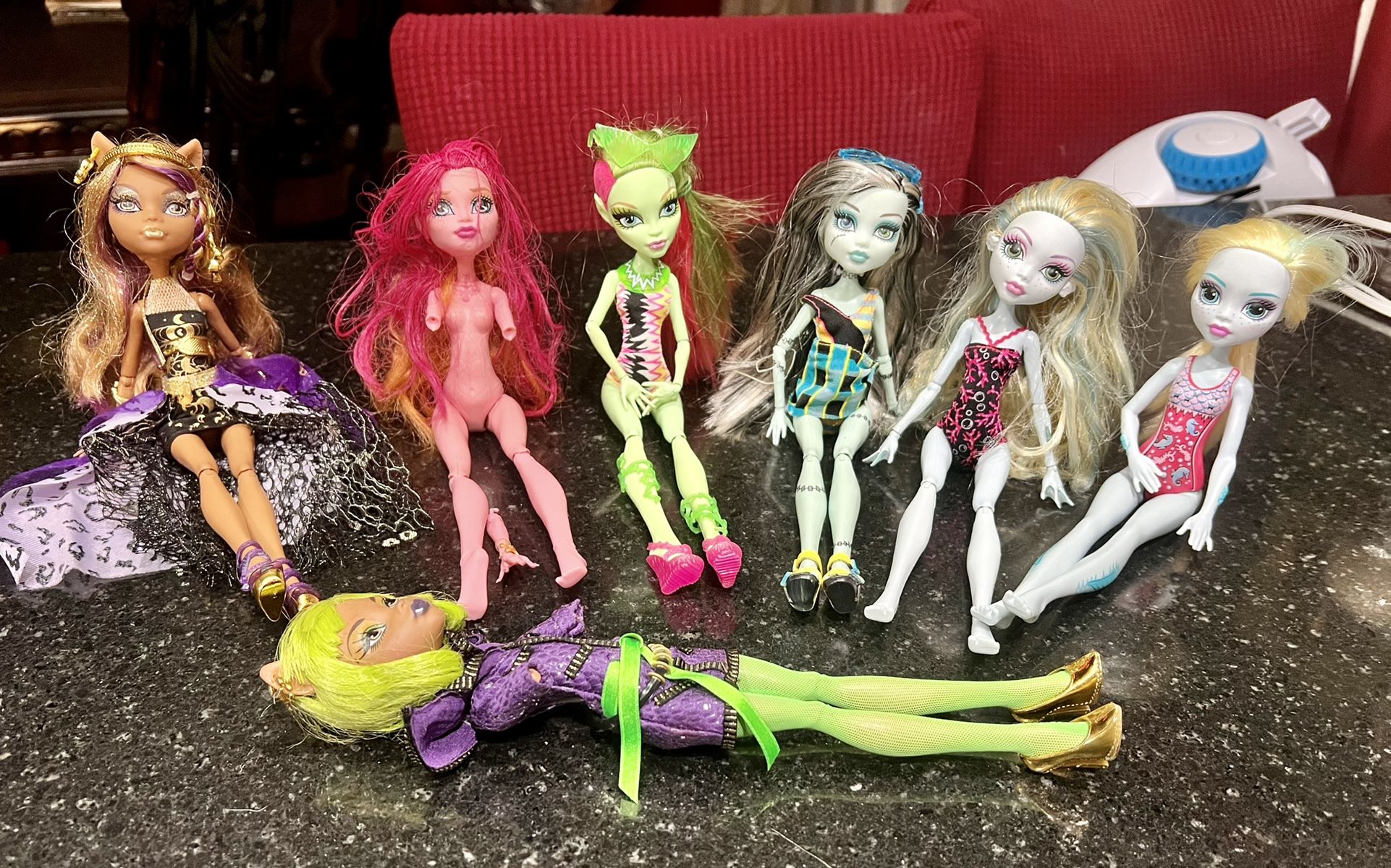 lot of monster high dolls. 