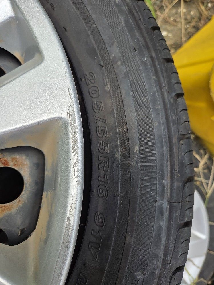 Set of Tires with rims and OEM Nissan Wheel hubs