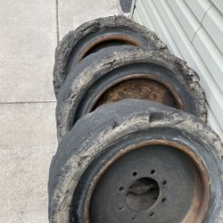 Four Bobcat Wheels And Tires 12-16.5 Solid