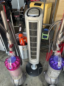 2 Dyson vacuums