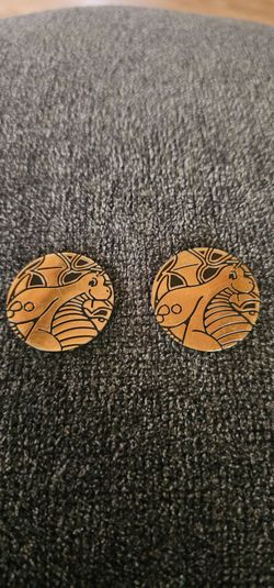 Pokemon Trading Card Game collector coins featuring Dragonite