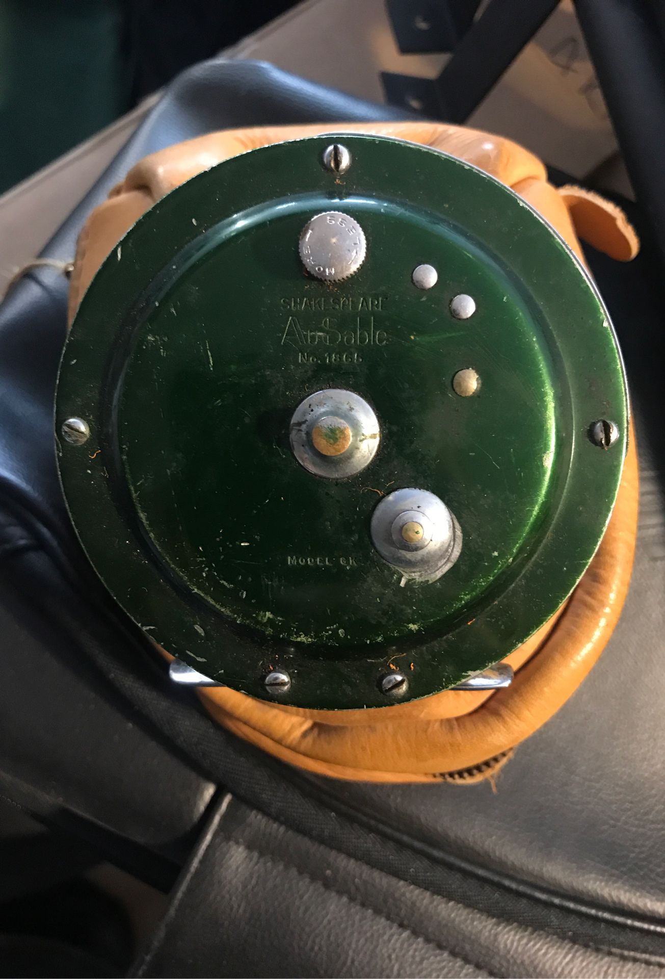 Shakespeare fly-fishing reel with leather holder
