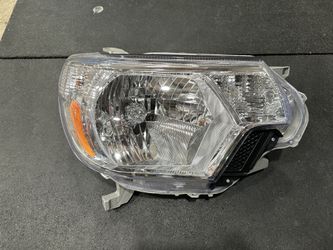 TYC (Aftermarket) 12-15 Toyota Tacoma Headlight Housings And Morimoto License Plate LED Lamps