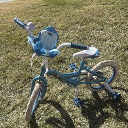 Selling Frozen bike with training wheels, 16-inch wheels.