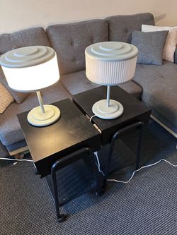 Two ikea nightstands with lamps