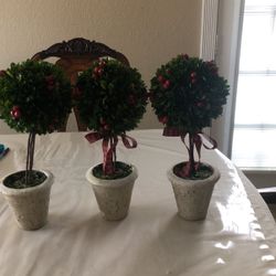 ARTIFICIAL PLANTS - One Is Missing A Bow- They Are About 16 Inches - Each Is 10