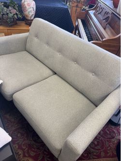 West Elm style sofa features a tailored, tight-back design with classic button tufting - 64”
